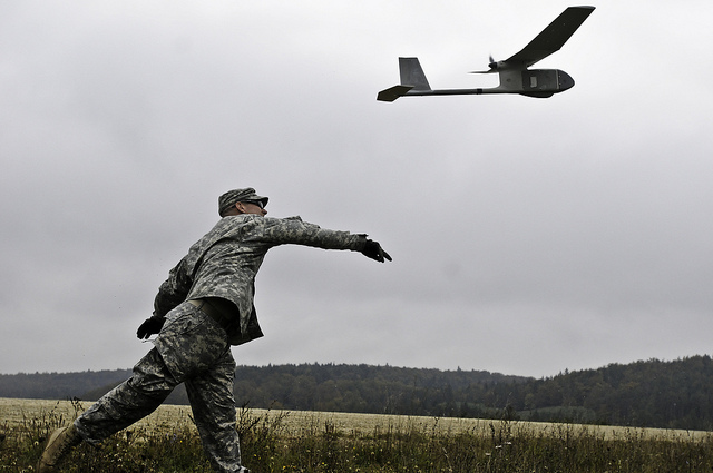 Sgt. Jason E. Gerst, a Virginia Beach, Va., native, now a squad leader with 2nd Platoon, A Company, 2nd Battalion, 18th Infantry Regiment, 170th Infantry Brigade Combat Team, launches the RQ-11B Raven unmanned aerial vehicle during Raven training here, Oct. 5.